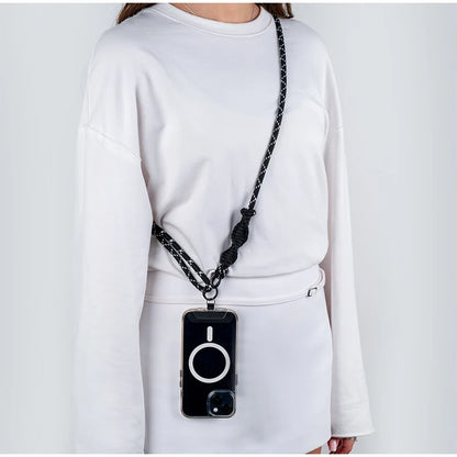 Czarny pasek do telefonu Kite crossbody noszony przez ramię na co dzień